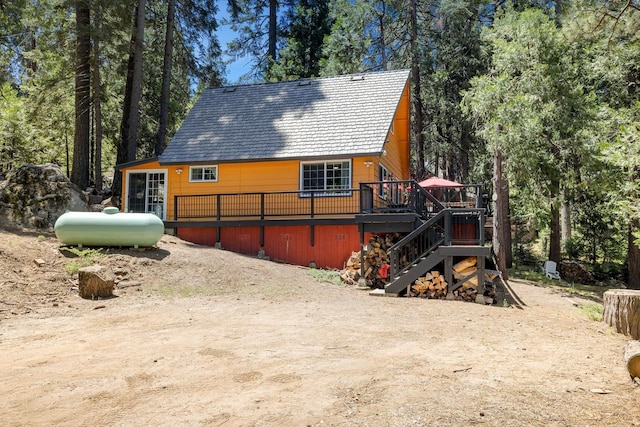 view of side of home featuring a deck