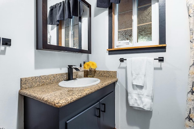 bathroom featuring vanity and a wealth of natural light