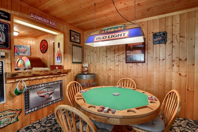 game room featuring wood walls and wooden ceiling