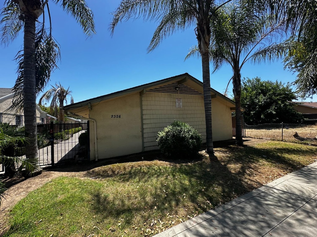 view of home's exterior featuring a yard