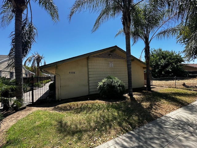 view of home's exterior featuring a yard