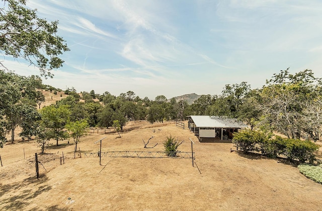 exterior space featuring an outbuilding and a rural view