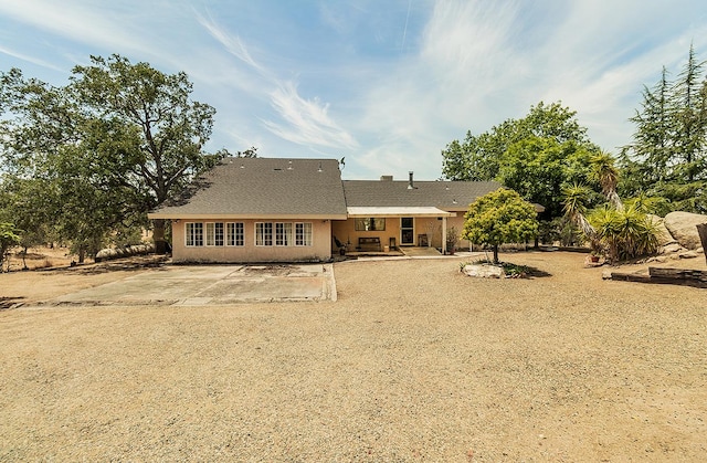 rear view of property with a patio area