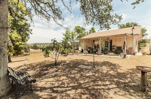 back of house with a patio area