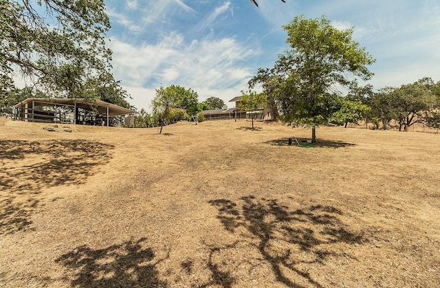 view of yard with a rural view