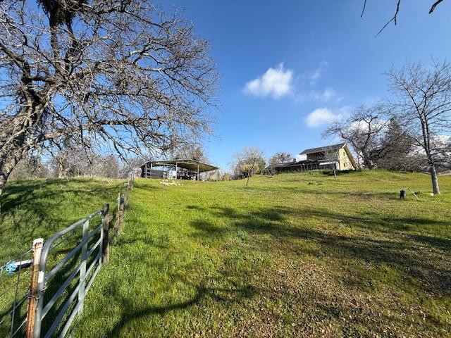 view of yard with a rural view