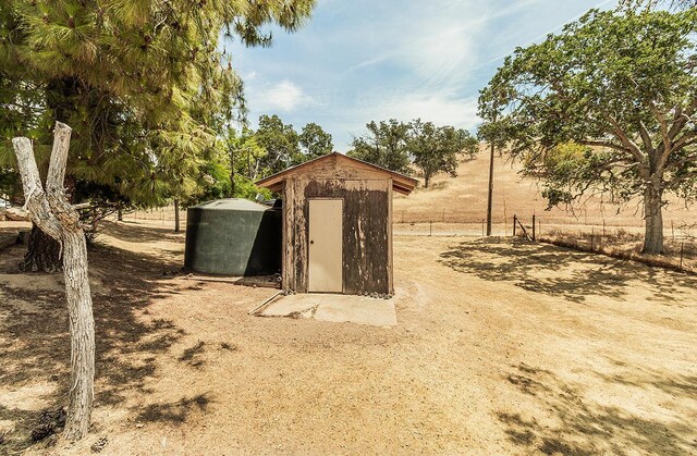 view of outbuilding with a rural view