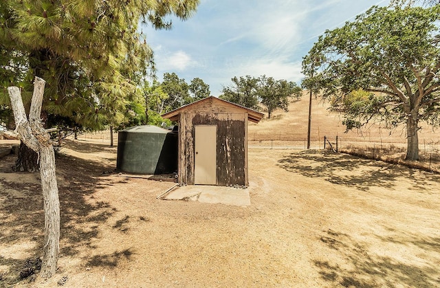 view of outdoor structure featuring a rural view