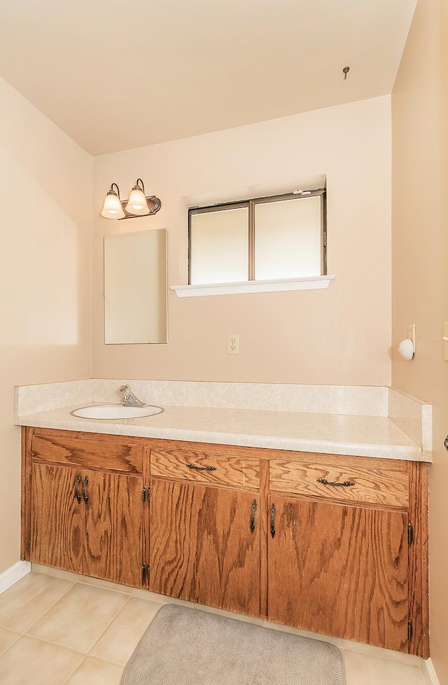 bathroom featuring tile patterned flooring and vanity