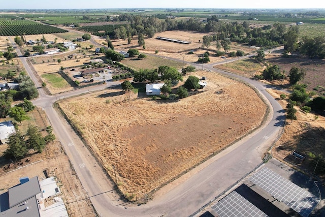 birds eye view of property with a rural view