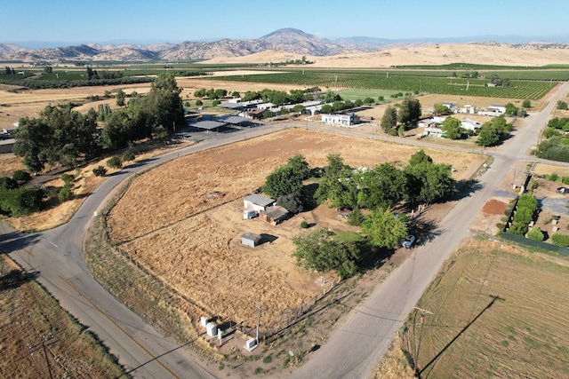 bird's eye view featuring a mountain view and a rural view