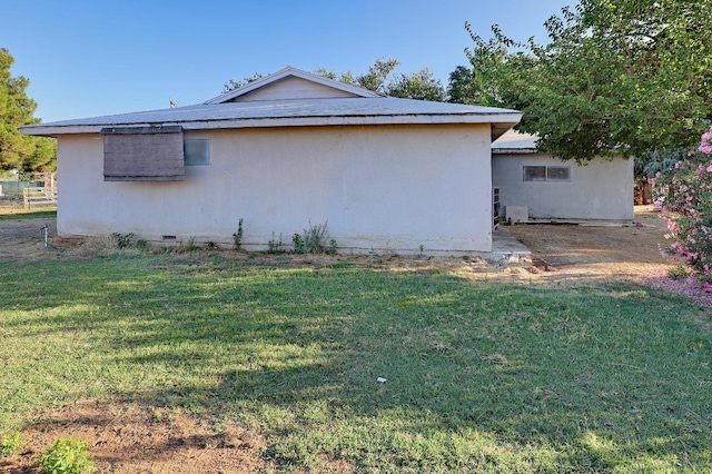 view of property exterior featuring a yard