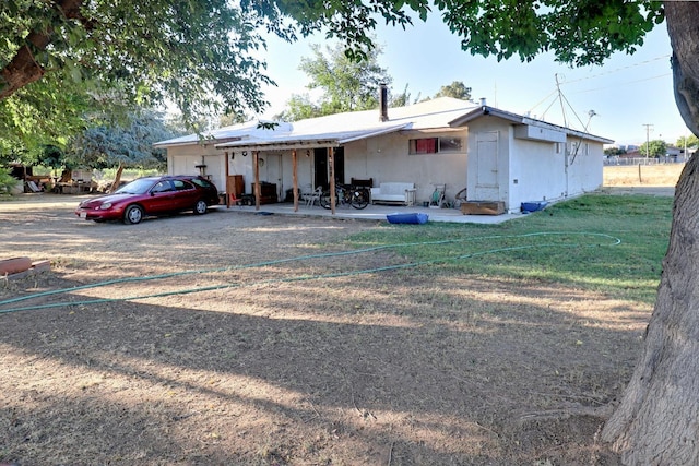 ranch-style home featuring a patio