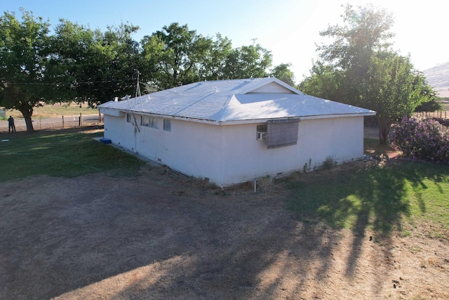 view of property exterior with a yard