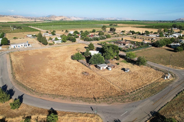 birds eye view of property with a mountain view and a rural view