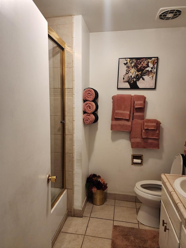 full bathroom featuring vanity, tile patterned floors, toilet, and combined bath / shower with glass door