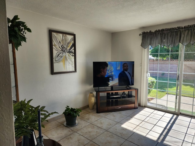 tiled living room with a textured ceiling