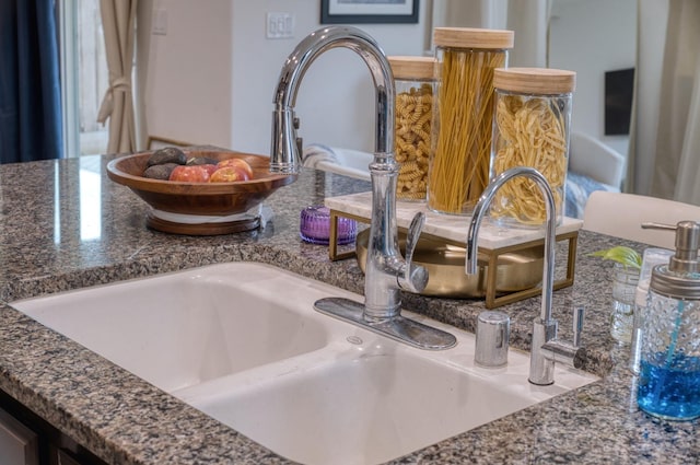 room details with dark stone counters and sink