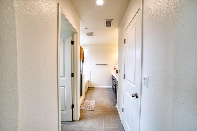 hall featuring tile floors