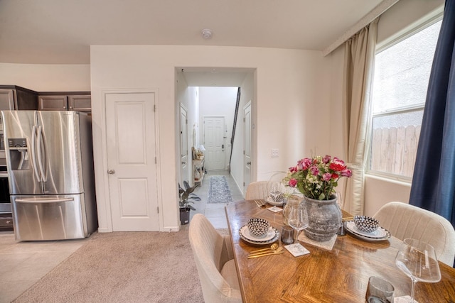 dining area with light colored carpet