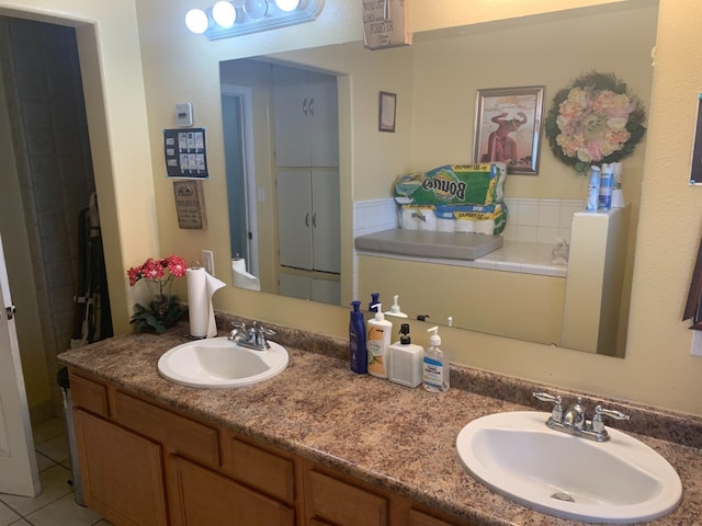 bathroom featuring tile floors, dual sinks, and oversized vanity