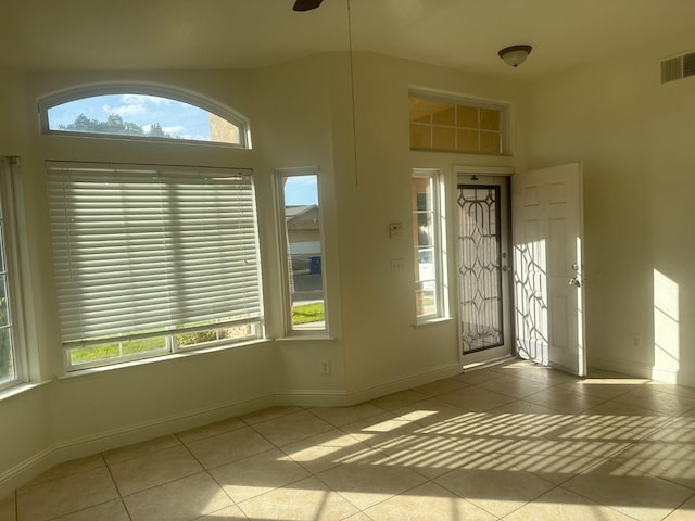 tiled entryway featuring plenty of natural light