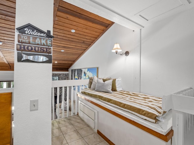 bedroom with wooden ceiling, light tile patterned floors, and lofted ceiling