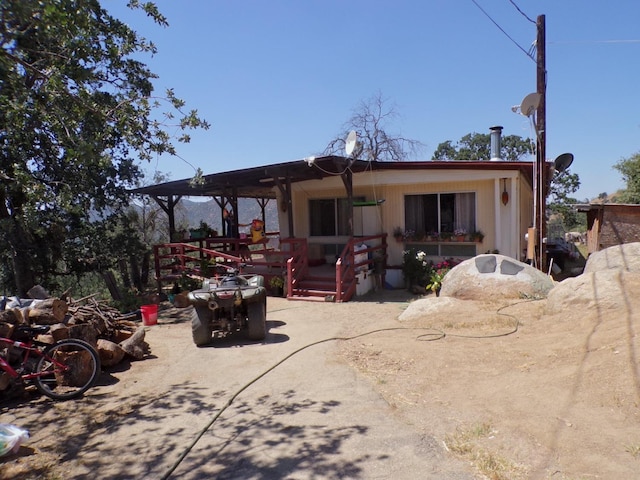 36839 Hopewell Rd, Yokuts Valley, CA 93675 - rear view of property featuring a wooden deck