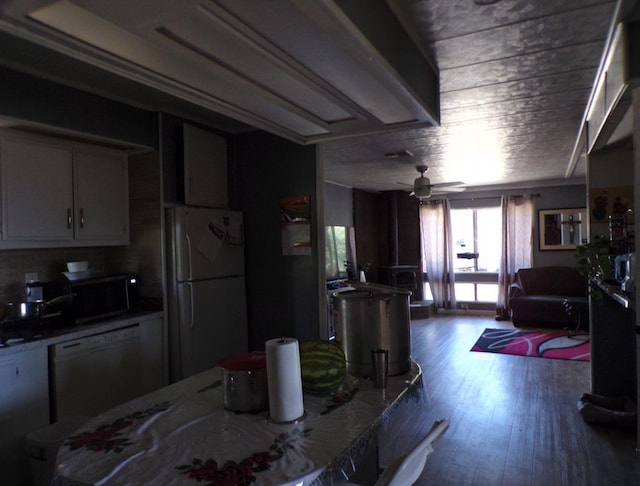 36839 Hopewell Rd, Yokuts Valley, CA 93675 - kitchen featuring freestanding refrigerator, dishwashing machine, wood finished floors, stainless steel microwave, and ceiling fan