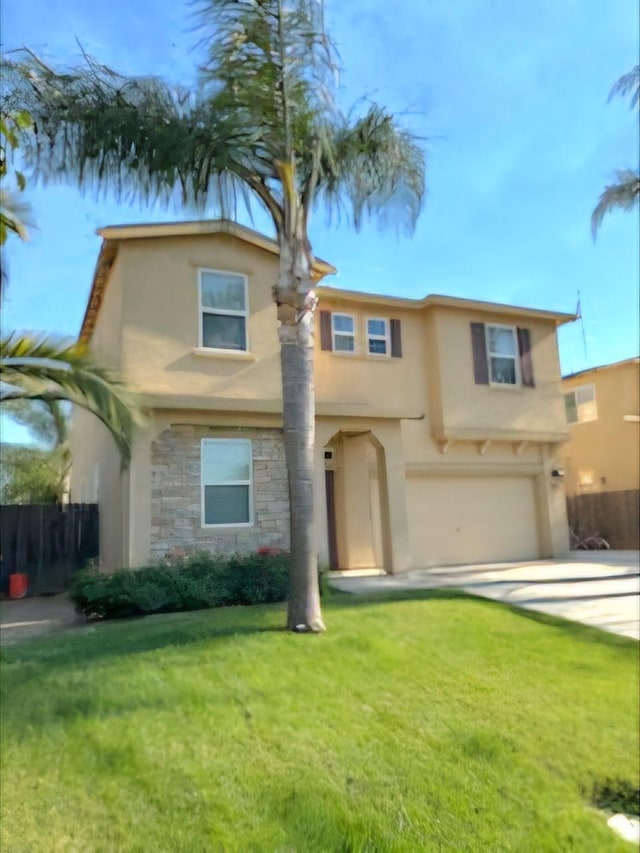 view of front of property featuring a front lawn and a garage