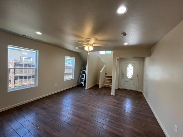 entryway featuring plenty of natural light, dark hardwood / wood-style flooring, and ceiling fan