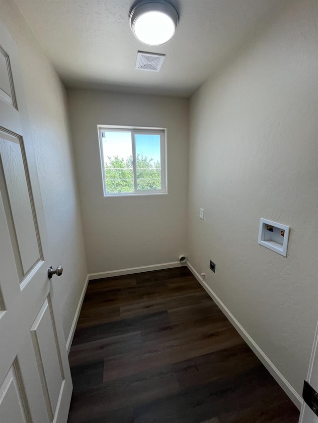 washroom with dark hardwood / wood-style floors and washer hookup