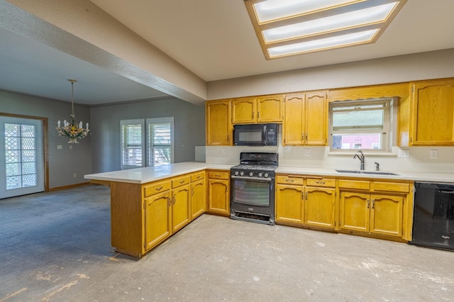 kitchen with sink, hanging light fixtures, a wealth of natural light, black appliances, and kitchen peninsula