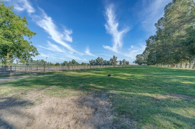 view of yard with a rural view