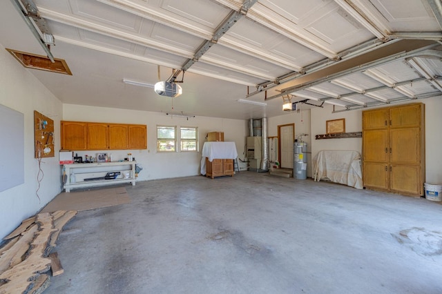 garage with secured water heater and a garage door opener