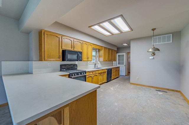 kitchen with hanging light fixtures, sink, kitchen peninsula, and black appliances