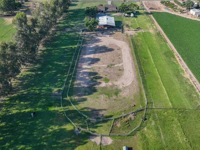 birds eye view of property with a rural view