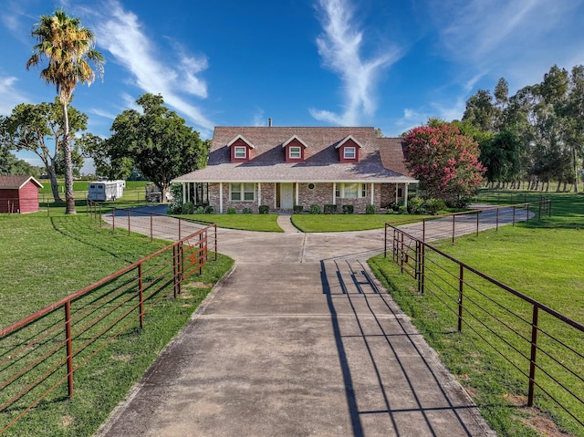 view of home's community with a lawn and a rural view