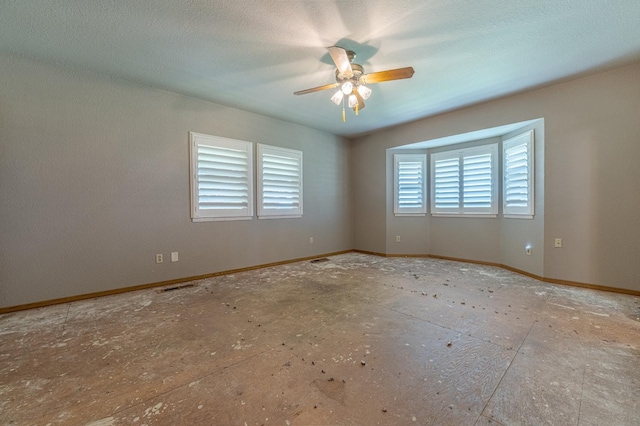 spare room with ceiling fan