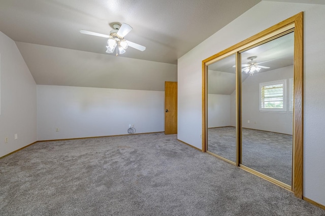 bonus room with ceiling fan, vaulted ceiling, and carpet