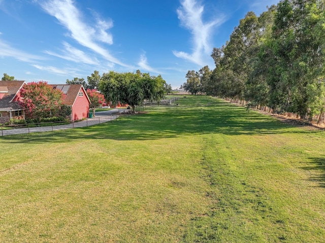 view of yard with a rural view