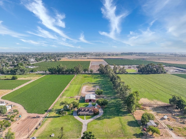 birds eye view of property with a rural view