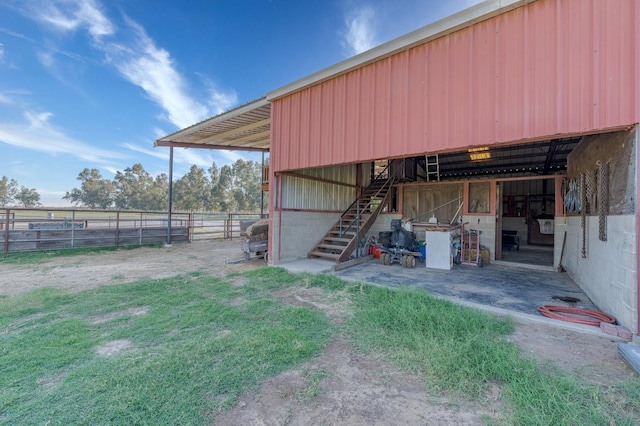 view of outdoor structure with a rural view