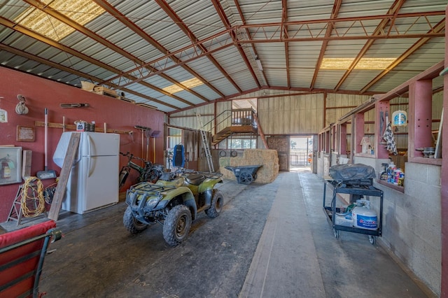 garage featuring white fridge