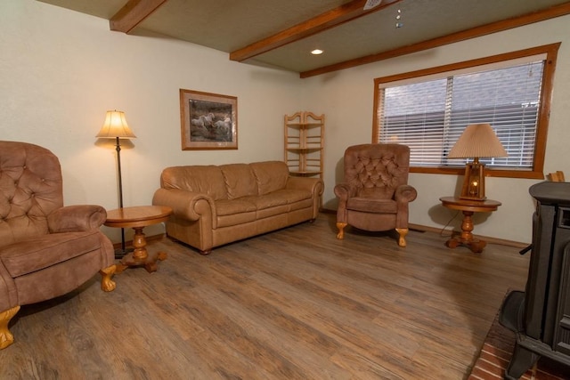 living room with hardwood / wood-style floors and beam ceiling