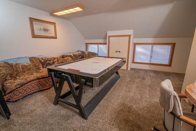 game room with carpet floors and vaulted ceiling