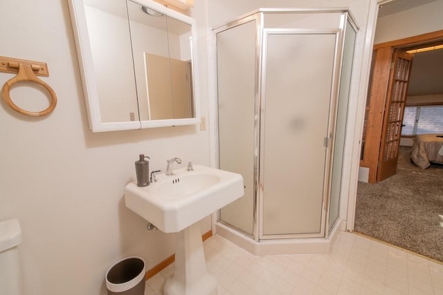 bathroom with a shower with shower door