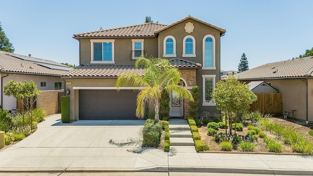 mediterranean / spanish-style house featuring a garage