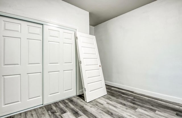 12647 E Clarkson Ave, Kingsburg, CA 93631 - unfurnished bedroom featuring hardwood / wood-style flooring and a closet