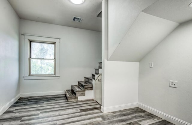 12647 E Clarkson Ave, Kingsburg, CA 93631 - staircase with wood-type flooring and a textured ceiling